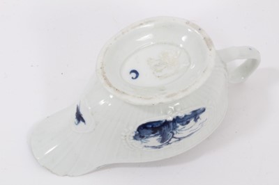 Lot 38 - A Worcester blue and white moulded sauceboat, circa 1760, painted with a variation of The Fisherman and Billboard Island pattern, crescent mark to base, 16cm long