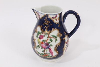 Lot 39 - A Worcester sparrow beak jug, circa 1770, polychrome painted with tropical birds on on a scale blue ground, pseudo-Chinese mark to base, 11.5cm high