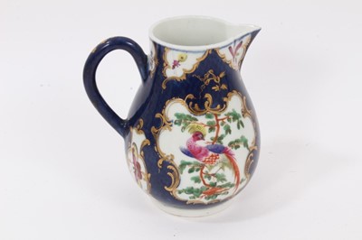 Lot 39 - A Worcester sparrow beak jug, circa 1770, polychrome painted with tropical birds on on a scale blue ground, pseudo-Chinese mark to base, 11.5cm high