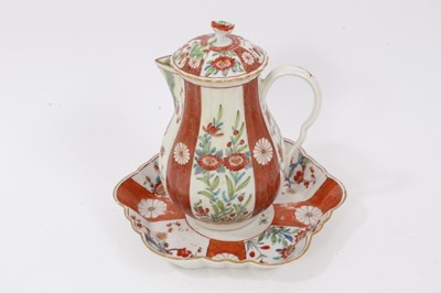 Lot 40 - Worcester Kakiemon style porcelain, circa 1770, including a sparrow beak jug, cover and dish on an orange ground, and a bowl and coffee cup on a blue ground (5)