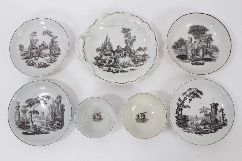 Lot 44 - Worcester porcelain teawares with black printed scenes by Hancock, including tea bowl, saucer and leaf-shaped dish with L'Amour, tea bowl and saucer with Milkmaids, and two saucers with ruins (7)
