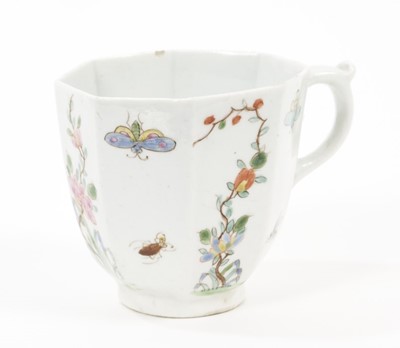 Lot 51 - A Worcester coffee cup, circa 1753, of octagonal form with a scrollwork handle, the sides painted with flowering plants alternating with insects in flight, 5.25cm high