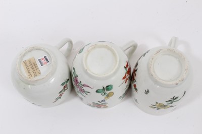 Lot 58 - A Liverpool Christian coffee cup, circa 1775, polychrome painted with floral sprays, together with two similar Worcester coffee cups (3)