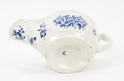 Lot 64 - A Worcester blue and white sauceboat, circa 1775, painted with flowers, crescent mark, 17.5cm long