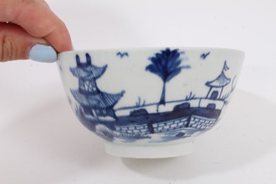 Lot 66 - A Worcester blue and white tea bowl and saucer, circa 1770, painted wih the Cannonball pattern, together with two similar tea bowls and bowl, and a tea bowl painted with Chinese figures (6)