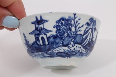 Lot 66 - A Worcester blue and white tea bowl and saucer, circa 1770, painted wih the Cannonball pattern, together with two similar tea bowls and bowl, and a tea bowl painted with Chinese figures (6)