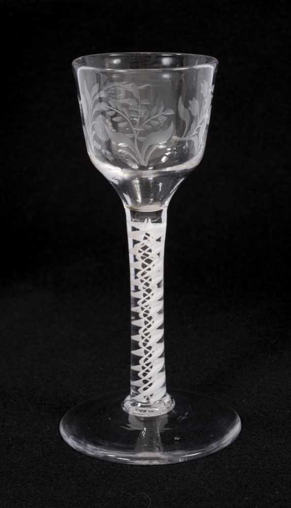 Lot 73 - Georgian double series opaque twist wine glass, circa 1765, the ogee bowl etched with flowers, on a conical foot, 13.25cm high