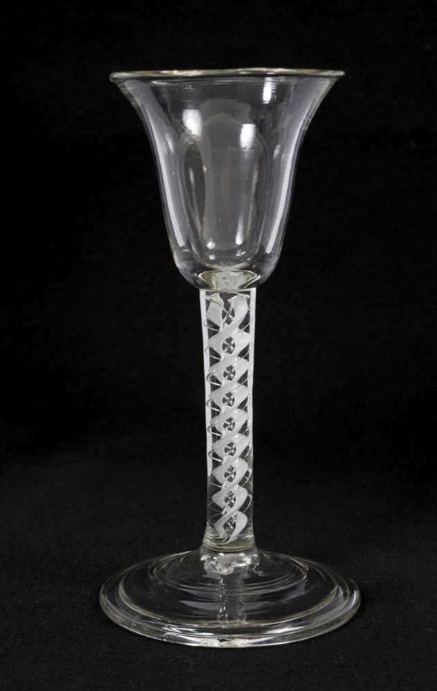 Lot 74 - 18th century-style continental mixed opaque and air twist stem wine glass, with bell shape bowl and folded conical foot, 15.75cm high