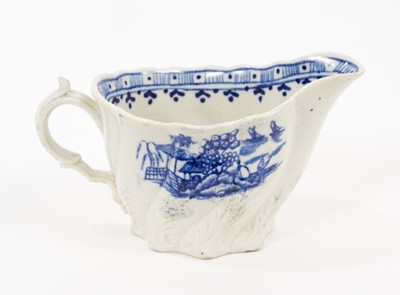 Lot 157 - A Liverpool Pennington blue and white creamboat, circa 1790, of Low Chelsea Ewer form, printed with the Fence pattern, 12cm from spout to handle
