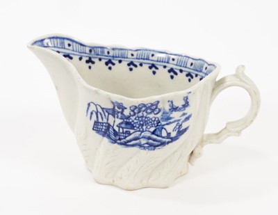 Lot 79 - A Liverpool Pennington blue and white creamboat, circa 1790, of Low Chelsea Ewer form, printed with the Fence pattern, 12cm from spout to handle