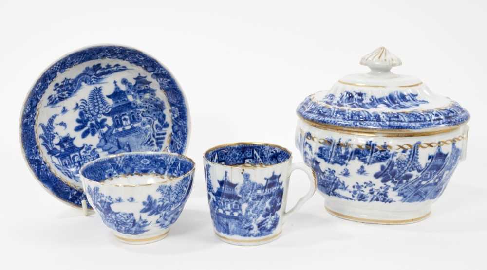 Lot 85 - A Chamberlains Worcester blue and white sucrier and trio, printed with Oriental landscapes (4)