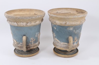 Lot 90 - Large pair of 19th century jasperware urns, probably Wedgwood, decorated with figural scenes on a two-tone light blue and buff ground, 29.5cm high