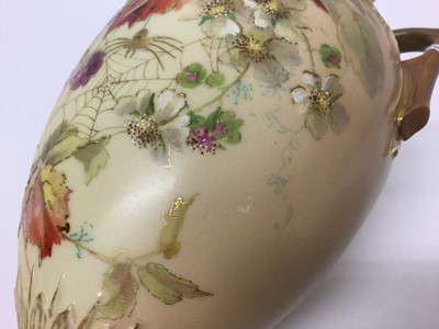 Lot 93 - A Royal Worcester twin-handled blush ivory vase, decorated with fruits and spiders, date code for 1898, 30cm high