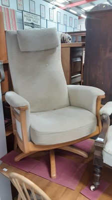 Lot 1287 - Ercol swivel chair and stool