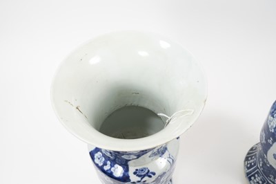 Lot 106 - Pair of 19th century Chinese blue and white Gu vases, one significantly damaged