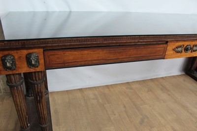 Lot 1303 - Fine Regency mahogany and ebony line inlaid serving table in the manner of George Oakley, with two frieze drawers between finely cast bronze lion mask mounts on four pairs of reeded legs, each with...