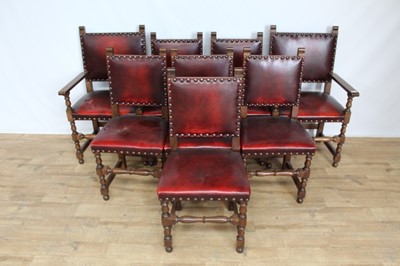 Lot 41 - Oak dining table and a set of 8 oak dining chairs with red leather upholstery