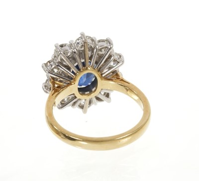 Lot 452 - Sapphire and diamond cluster ring