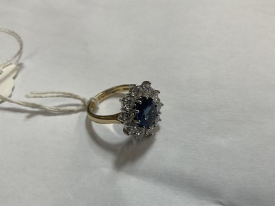 Lot 452 - Sapphire and diamond cluster ring