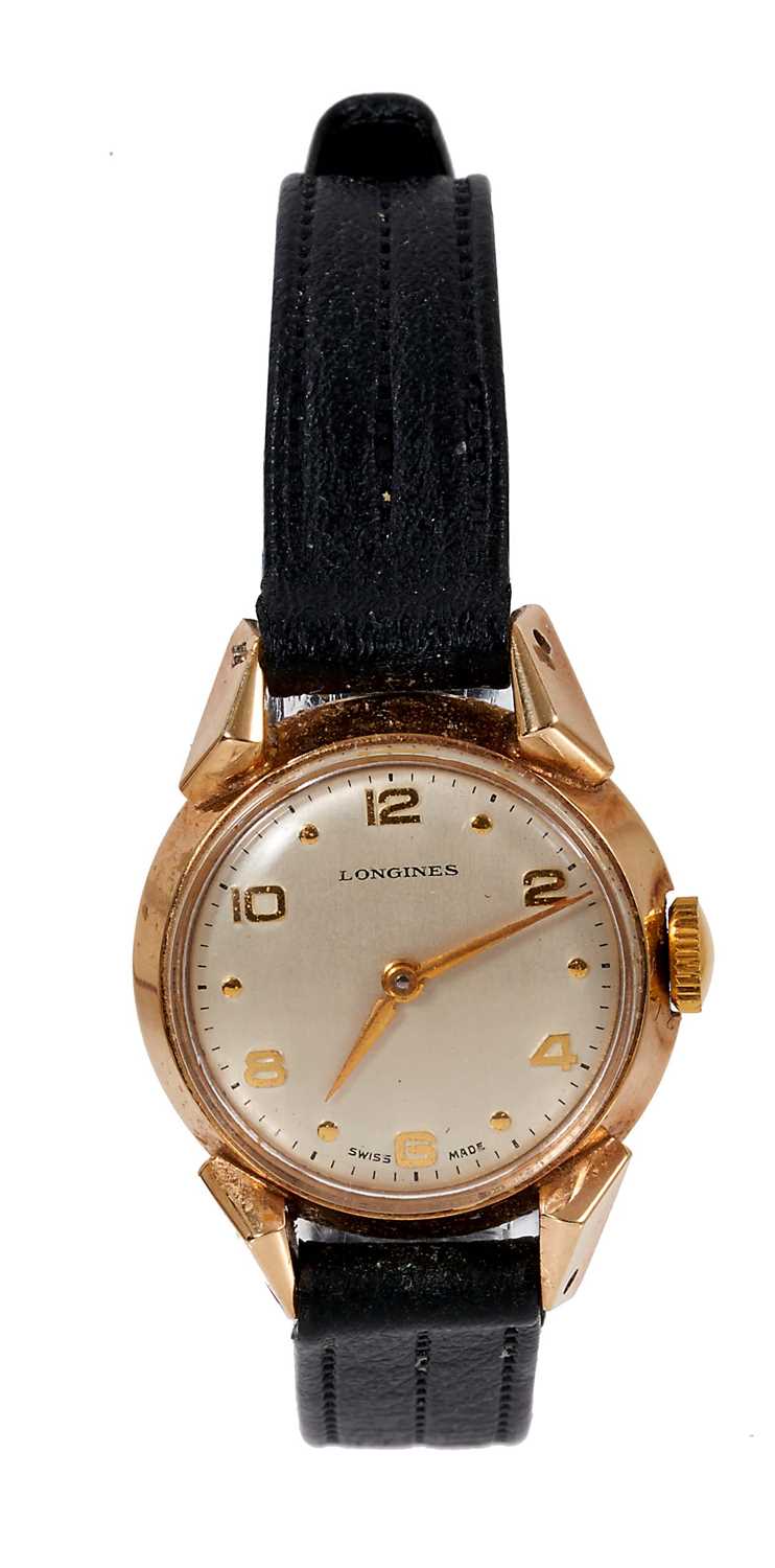 Lot 568 - 1950s ladies Longines gold wristwatch on black leather strap