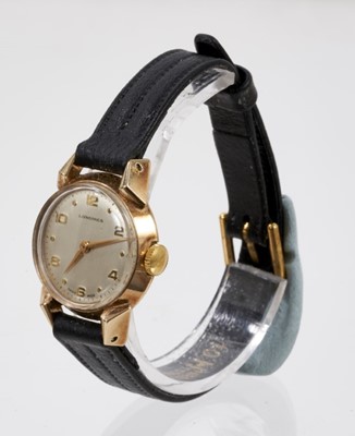 Lot 568 - 1950s ladies Longines gold wristwatch on black leather strap