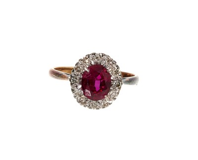 Lot 476 - Ruby and diamond cluster ring in platinum claw setting on 18ct yellow gold shank