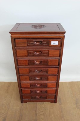 Lot 1057 - Oriental hardwood nest of eight drawers, 12" wide, 8" deep, 24" high