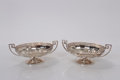 Lot 4 - Pair George V silver bon bon dishes of oval from with pierced border and Greek key handles raised on oval pedestal foot, (Sheffield 1926), maker Roberts & Belk, marked to base RD 609015, 14.8cm wid...