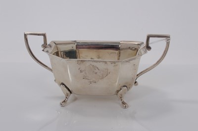 Lot 8 - 1930s silver sugar bowl of octagonal form with two angular handles raised on four pad feet, (Sheffield 1936), maker Viners, 18cm wide, (7.6oz)