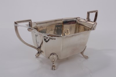 Lot 8 - 1930s silver sugar bowl of octagonal form with two angular handles raised on four pad feet, (Sheffield 1936), maker Viners, 18cm wide, (7.6oz)