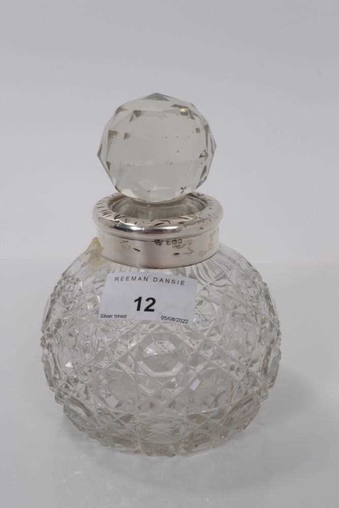 Lot 12 - George V silver mounted cut class scent bottle of globular form, (London 1917), maker JHW & Son, approx 14cm high