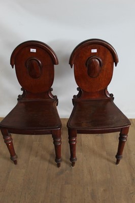 Lot 1086 - Pair of Victorian mahogany hall chairs on turned front legs