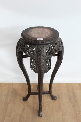 Lot 1089 - Good quality oriental carved hardwood jardinière stand with inset marble top and pierced decoration, 36" high