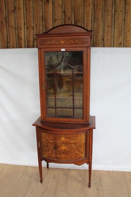 Lot 1090 - Good quality Edwardian inlaid mahogany display cabinet with shelved interior enclosed by glazed door, and further  panelled door below on square taper legs with spade feet, 27" wide, 18" deep, 76"...