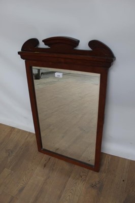 Lot 1099 - Edwardian walnut framed wall mirror with bevelled plate