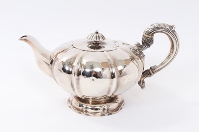 Lot 258 - William IV silver teapot of melon form, with hinged cover and silver leaf mounted handle