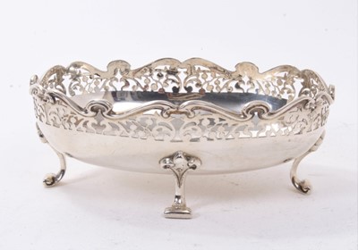 Lot 259 - Edwardian silver dish of oval form, with decorative pierced border on four scroll feet