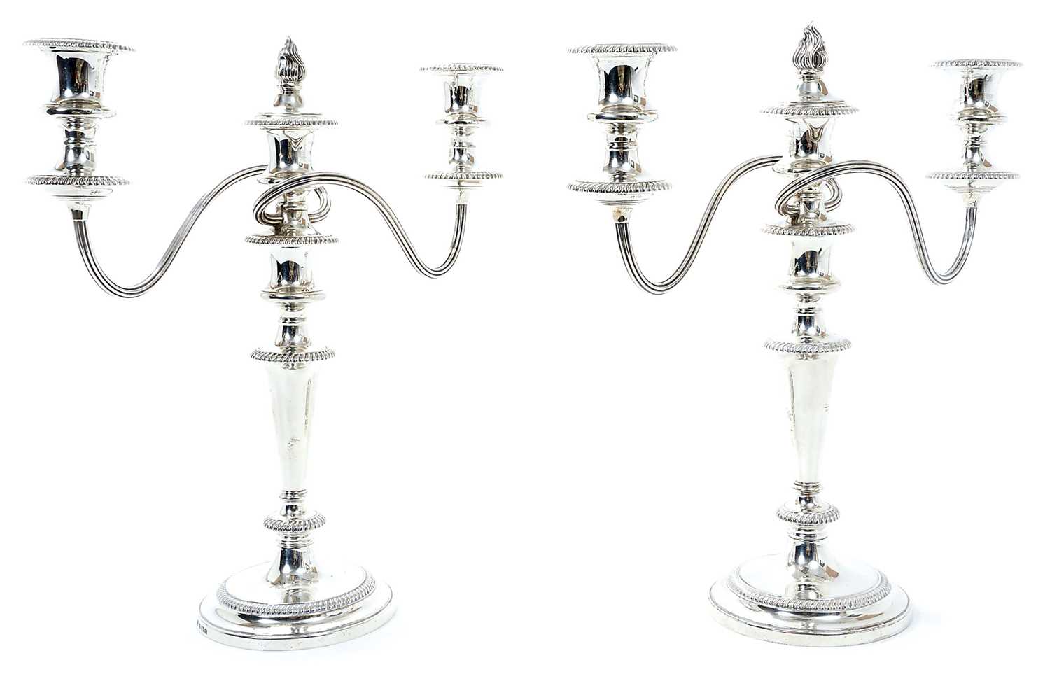 Lot 262 - Pair 1930s silver three light candelabra, with tapering stems and gadrooned borders