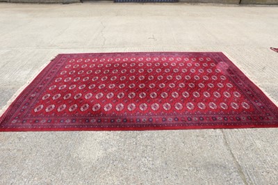 Lot 1428 - Large Tekke style carpet with seven rows of nineteen medallions.