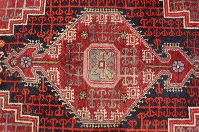 Lot 1491 - Persian rug with central medallion.