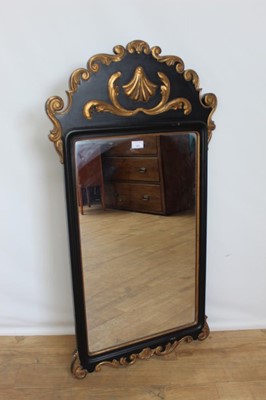 Lot 101 - Scandinavian ebonised and gilt wall mirror.