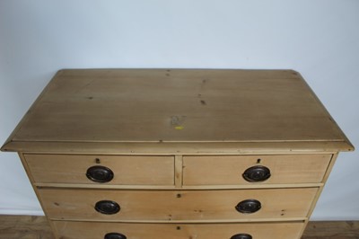 Lot 70 - Pine chest of drawers with embossed brass handles.