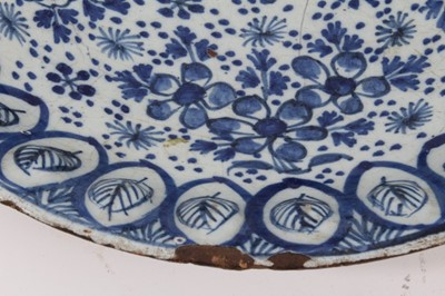 Lot 179 - An 18th century Dutch Delft dish, with unusual leaf moulded border
