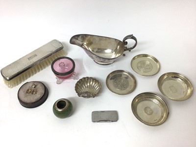 Lot 238 - A silver-mounted match pot, a silver-mounted cranberry glass salt, various white metal dishes, a silver shell salt and a plated sauceboat etc