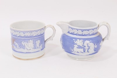 Lot 27 - A New Hall mug, with applied decoration, on a lilac ground, and dated 1819, and a similar jug