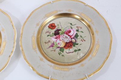 Lot 173 - Four English porcelain dessert plates, painted with flowers, on a grey and gilt ground, circa 
1840
