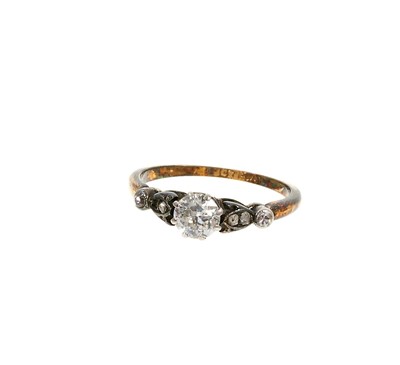 Lot 488 - Diamond single stone ring with an old cut diamond weighing 
approximately 0.40cts in platinum claw setting with rose cut 
diamonds to the shoulders on 18ct yellow gold shank