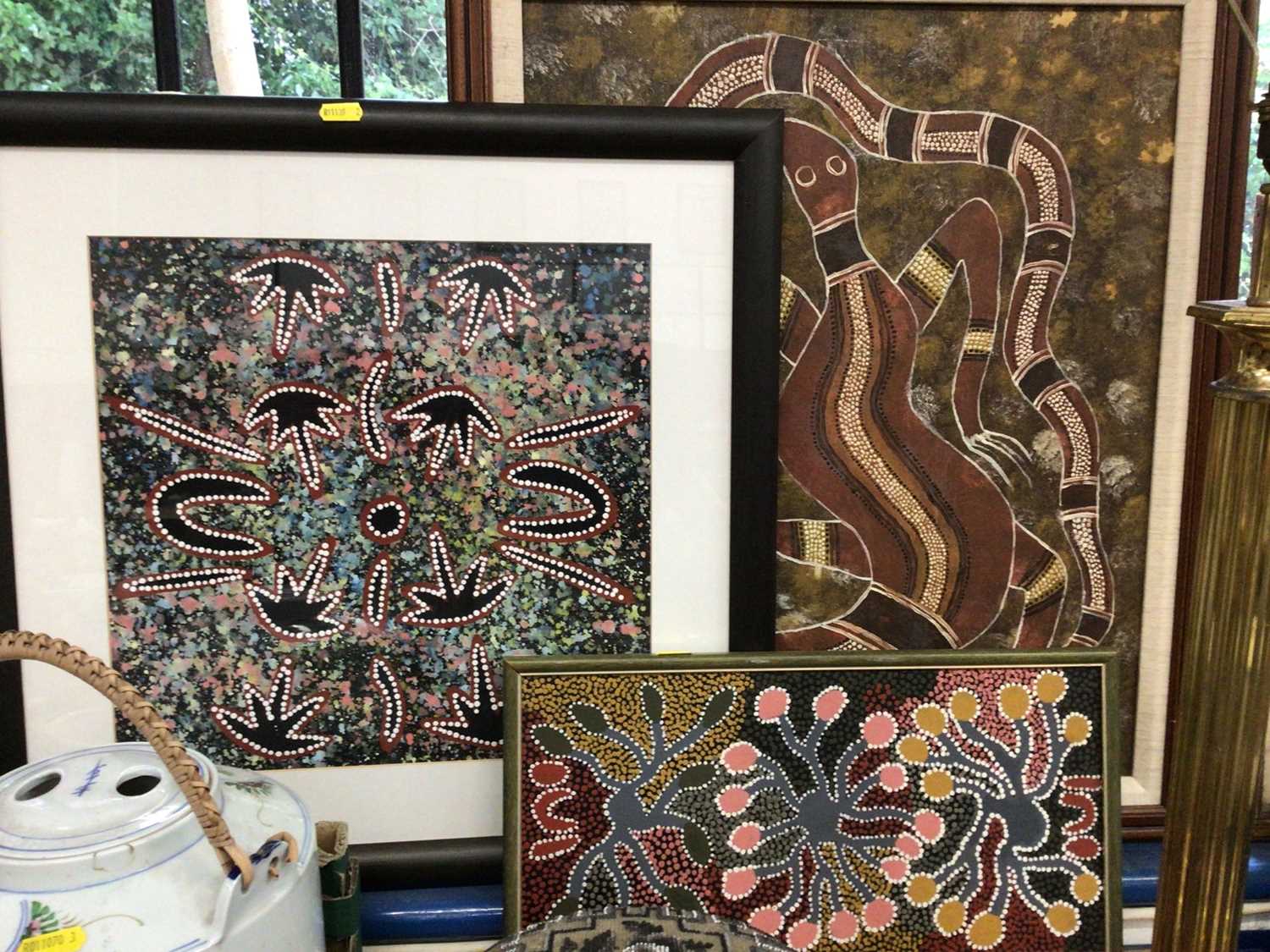 Lot 100 - Three Aboriginal paintings to include Reggie Sultan (Born 1955) - '2 people digging 2 goannas', Pinnole oil of a lizard and Audrey Nugarrai 'Women getting bush orange banana' (3)