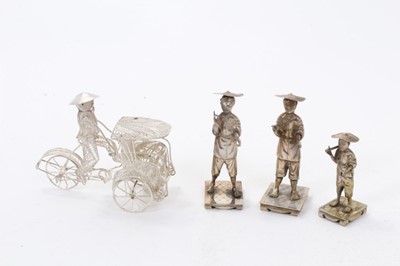 Lot 384 - Three Chinese silver figures with character marks to bases, one also marked for Hung Chong together with a Chinese white metal filigree rickshaw. All at 3ozs (4)