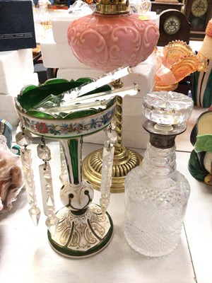 Lot 303 - Bohemian green flash-cut glass lustre, silver collared cut glass decanter, brass oil lamp with pink glass reservoir and other coloured glassware